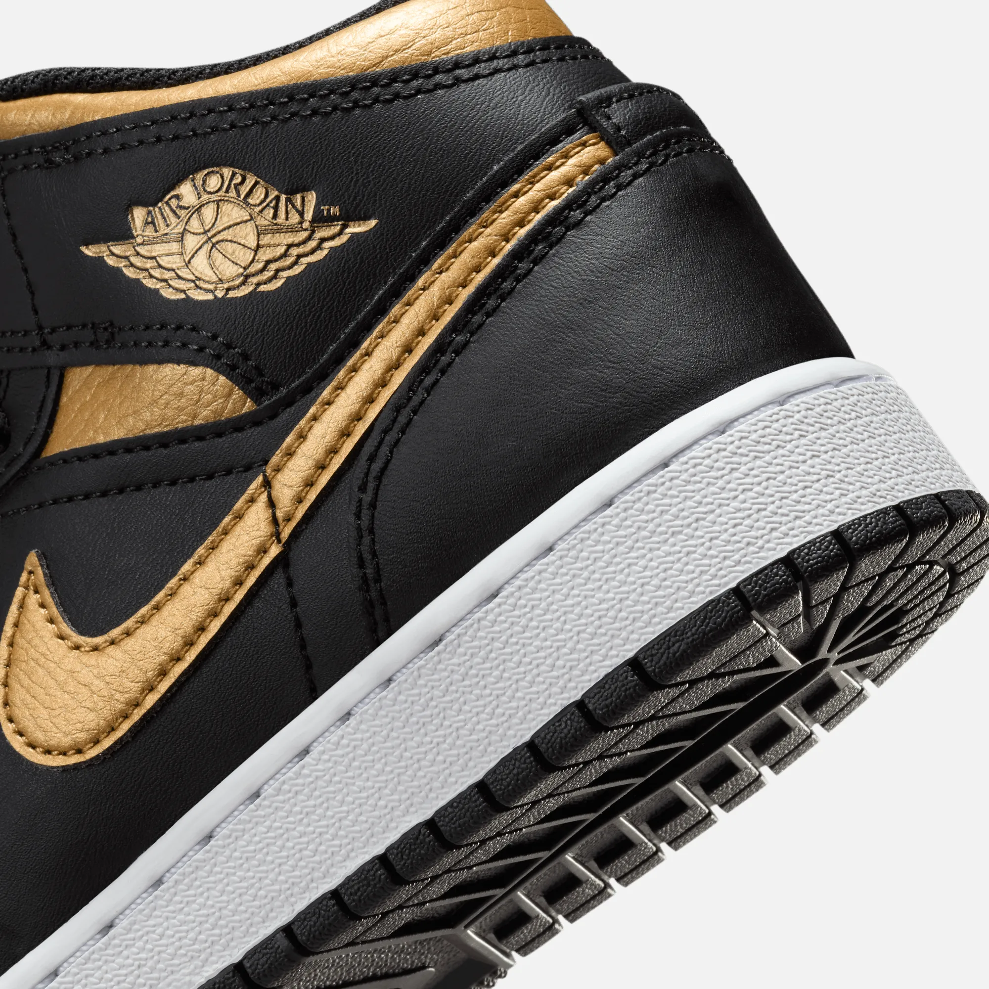 Air Jordan Big Kids' 1 Mid Black Metallic Gold (GS)